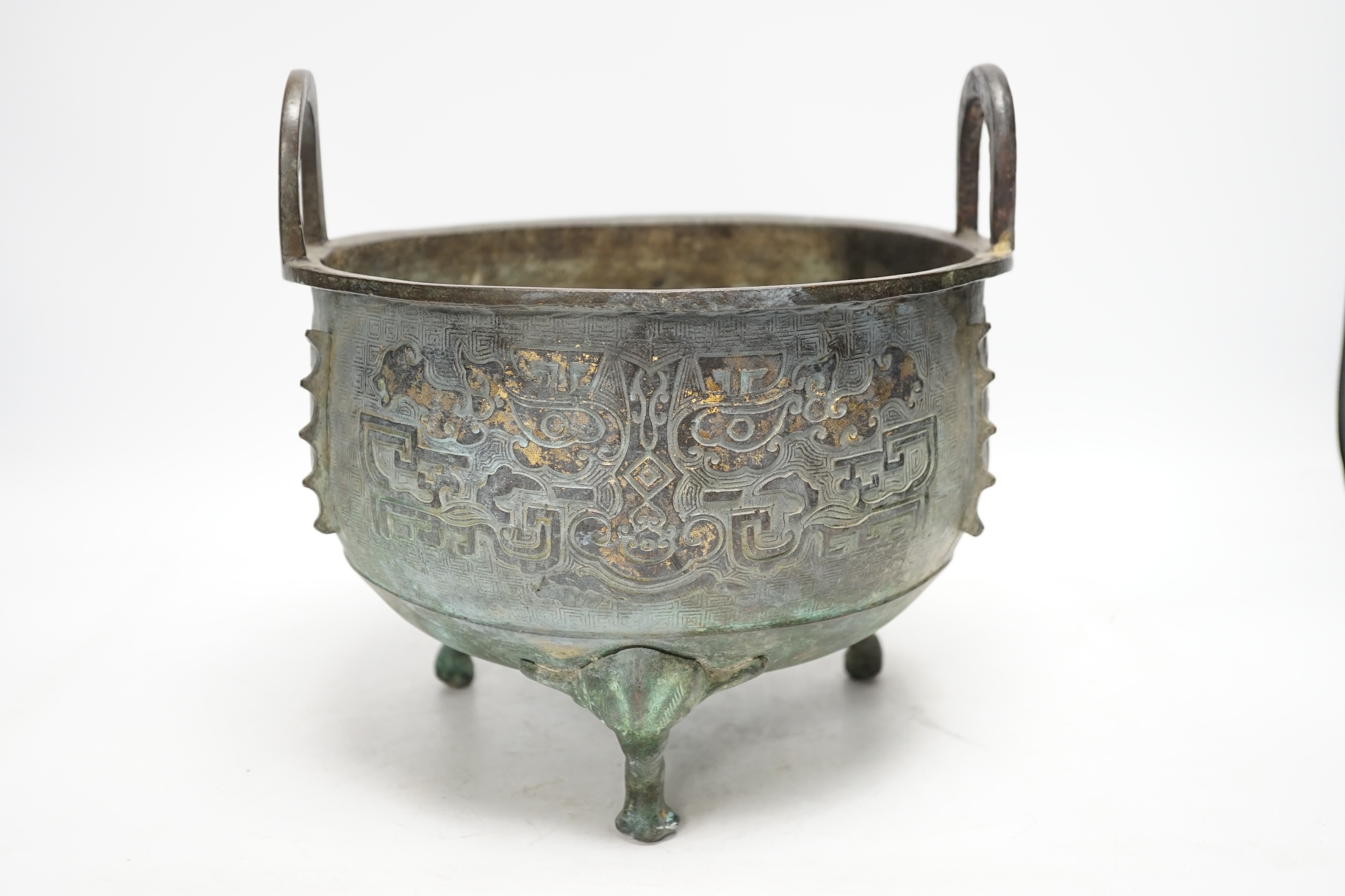 A large Chinese parcel gilt bronze tripod censer, 24.5cm high, 25cm diameter. Condition - fair